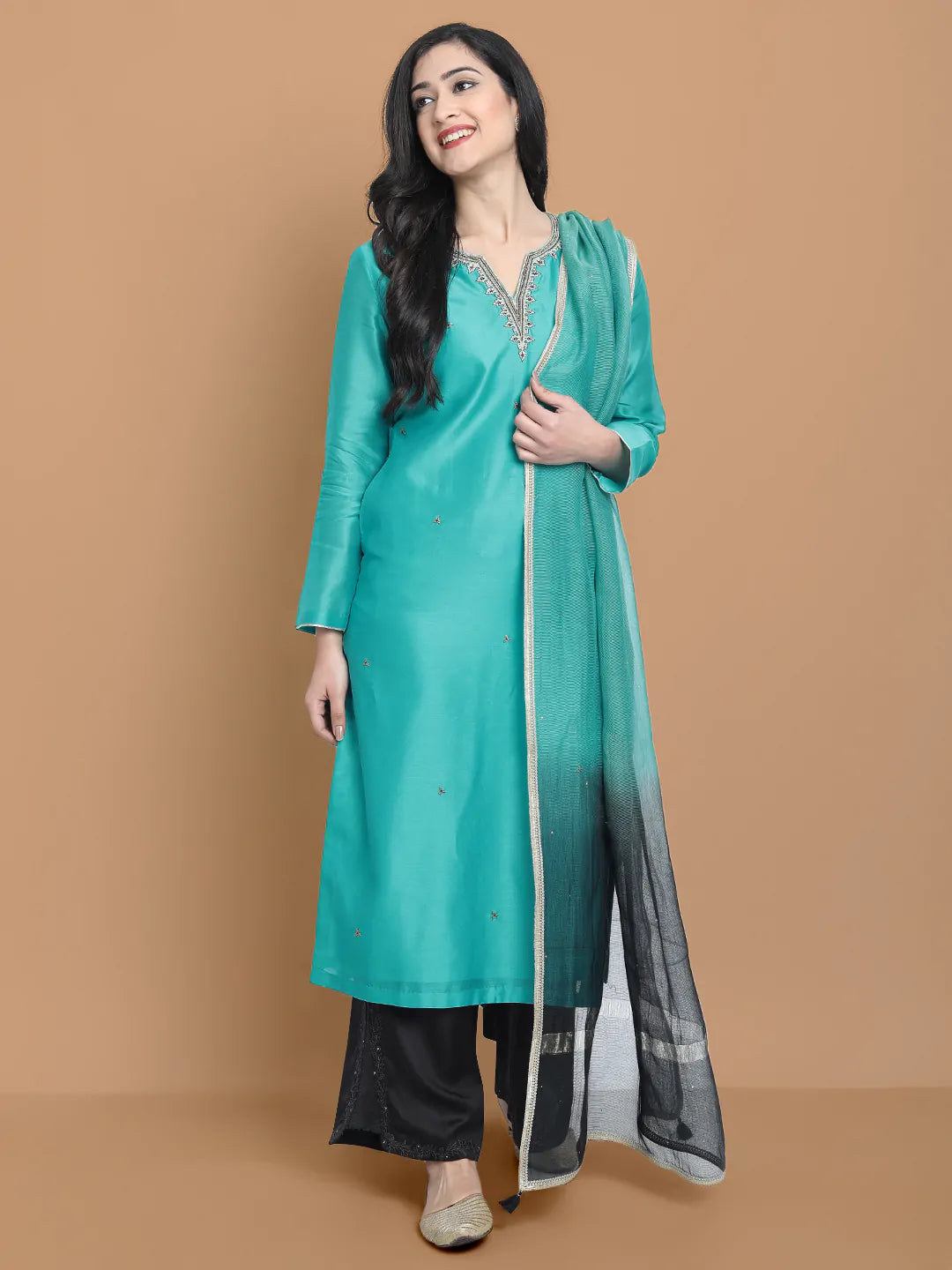 Royal blue silk chanderi kurta , accentuated with exquiste zari embroidery , mixture of hand and machine , sprinkled all over , paired with zari net dupata and modal satin slit plazo