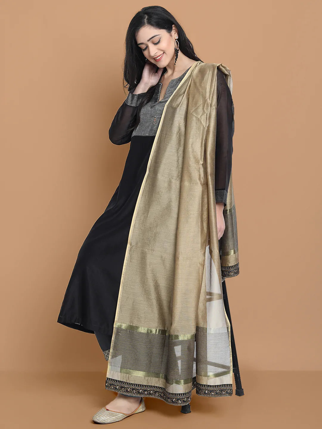 Black silk chanderi Dress Accentuated with Exquisite hand embroidery signifing beauty is in the detailing.