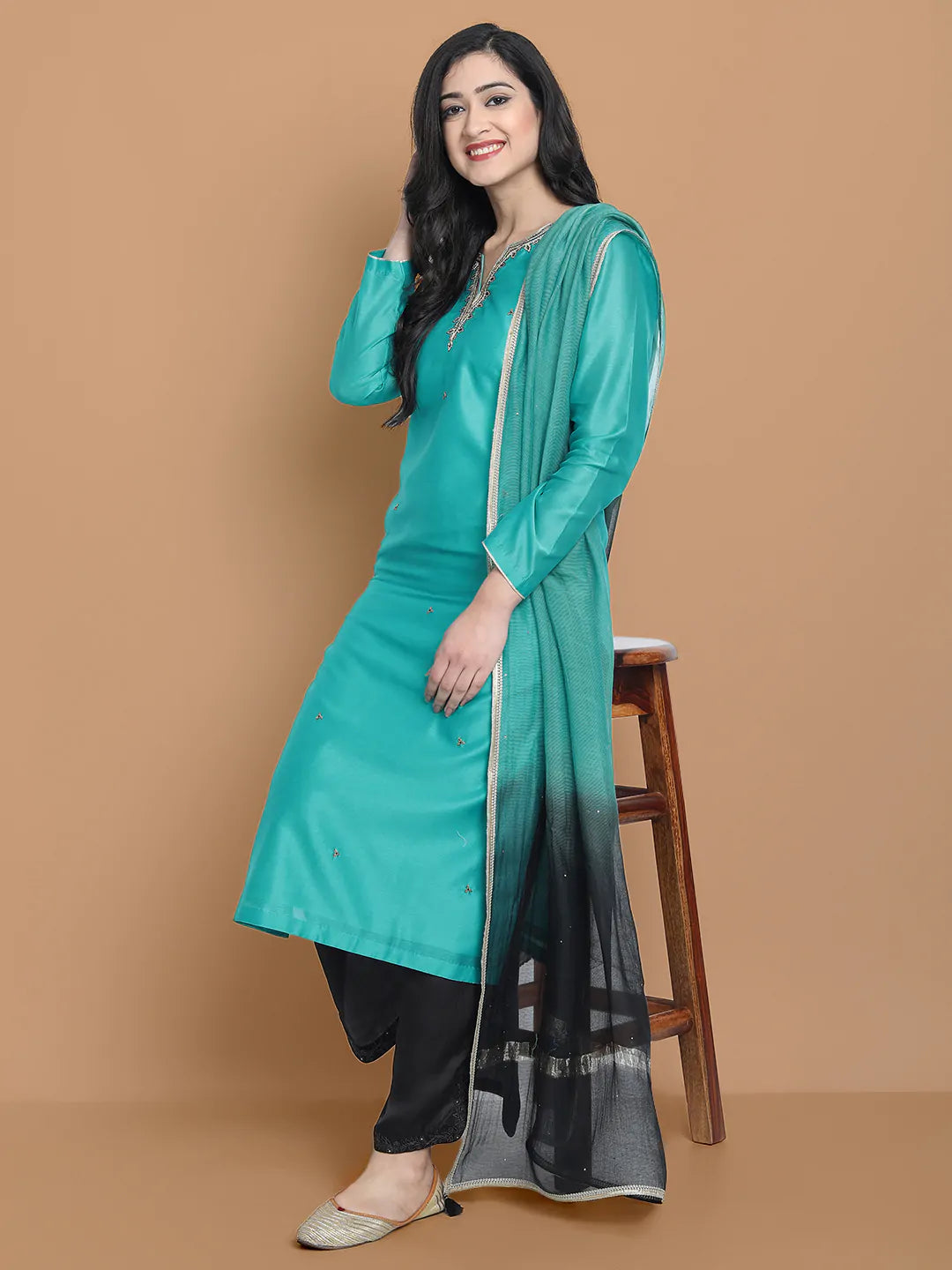Royal blue silk chanderi kurta , accentuated with exquiste zari embroidery , mixture of hand and machine , sprinkled all over , paired with zari net dupata and modal satin slit plazo