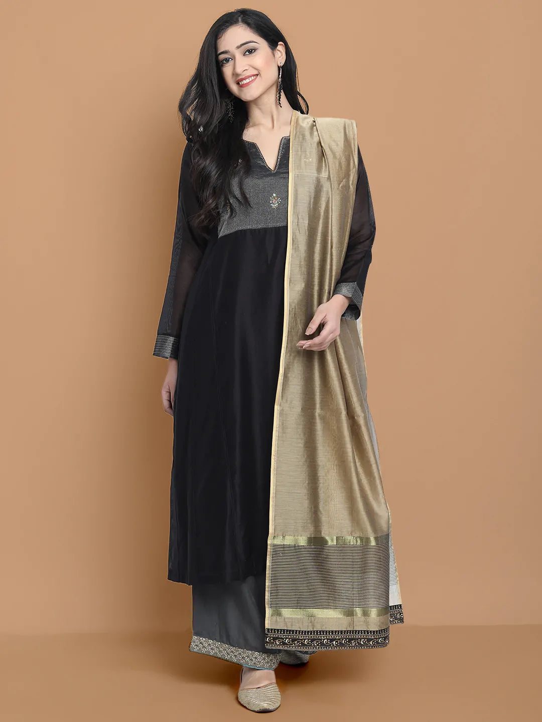 Black silk chanderi Dress Accentuated with Exquisite hand embroidery signifing beauty is in the detailing.