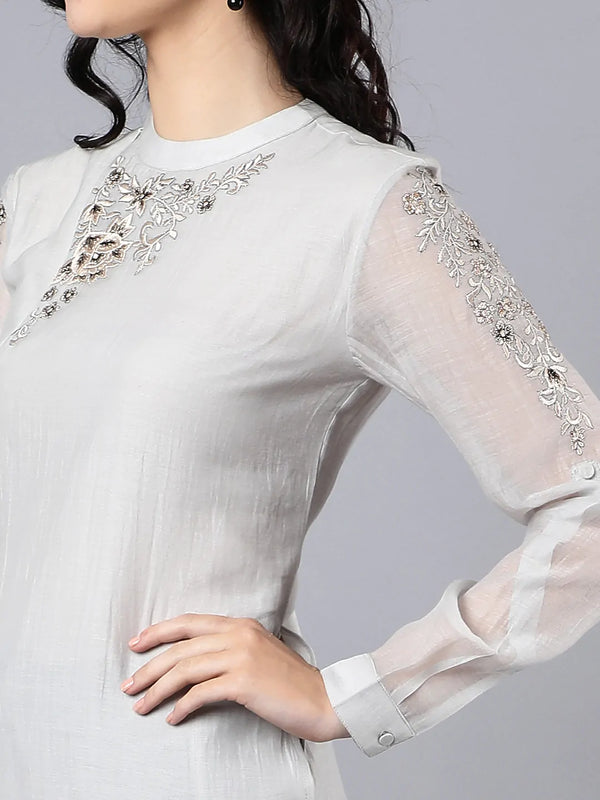 Chanderi kurta with resham and badla embroidery paired with chanderi pencil pants