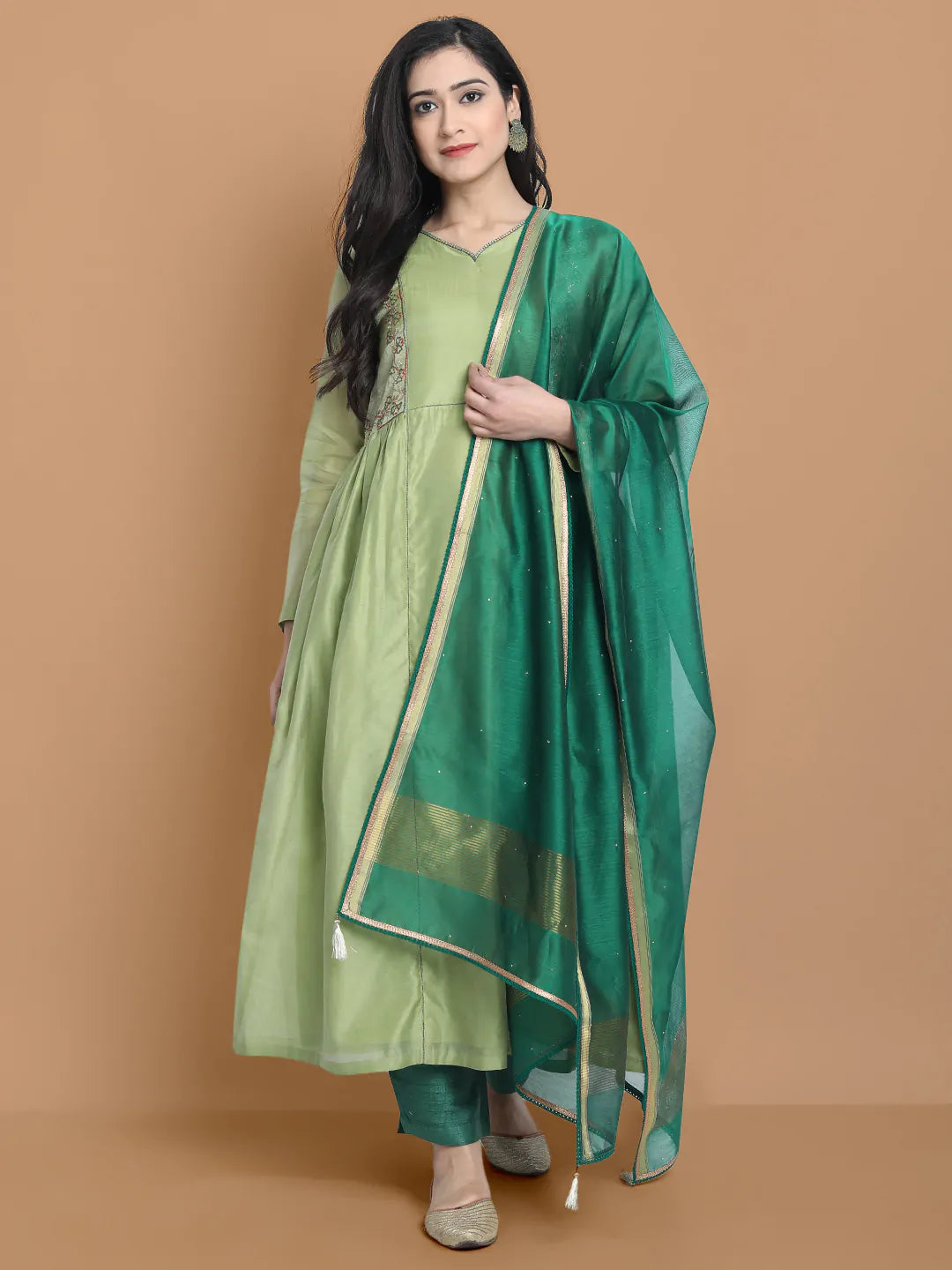 Light green silk chanderi kurta accentuated with exquisite hand embroidery and got emb at the neck , paired with cotton trouser