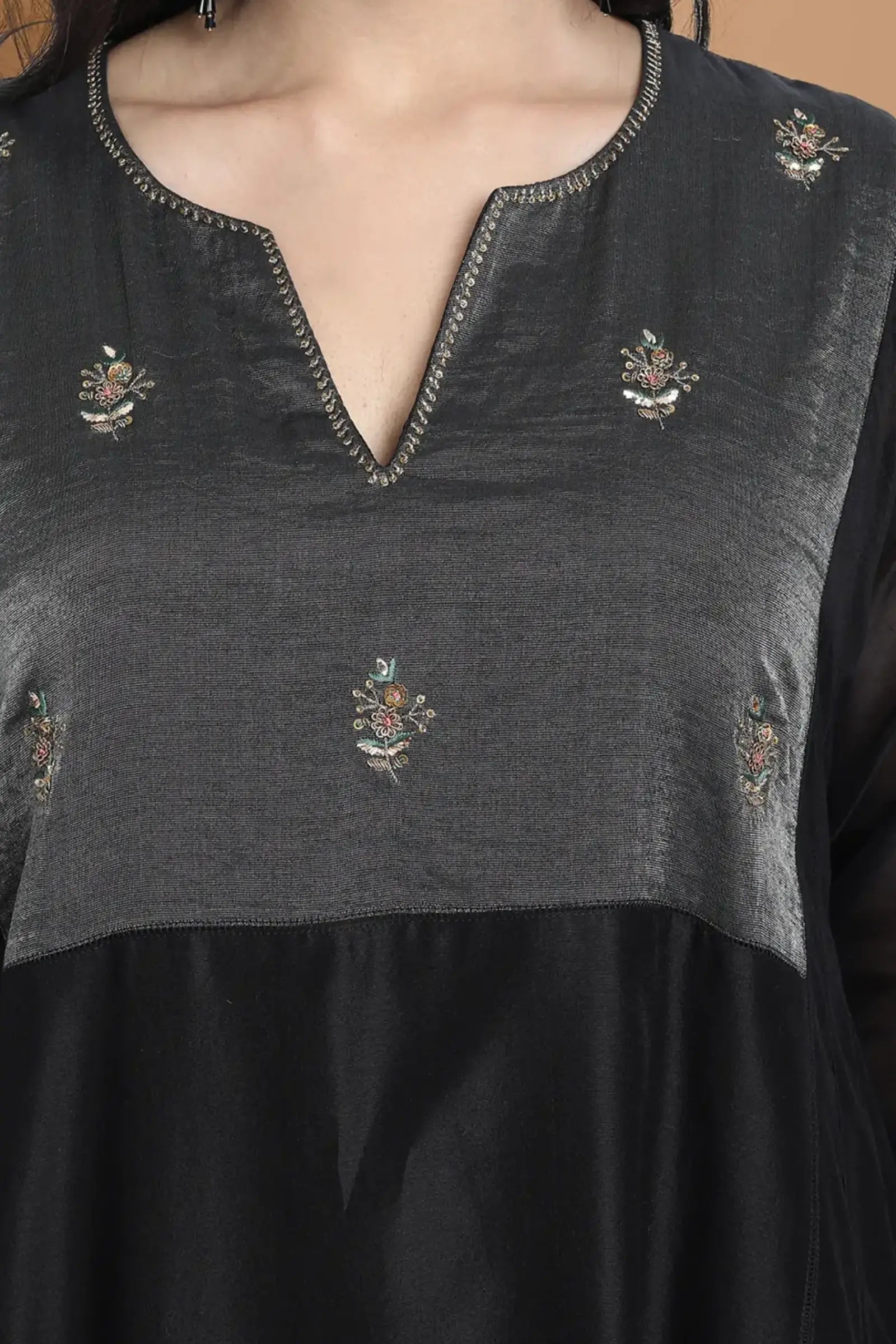 Black silk chanderi Dress Accentuated with Exquisite hand embroidery signifing beauty is in the detailing.