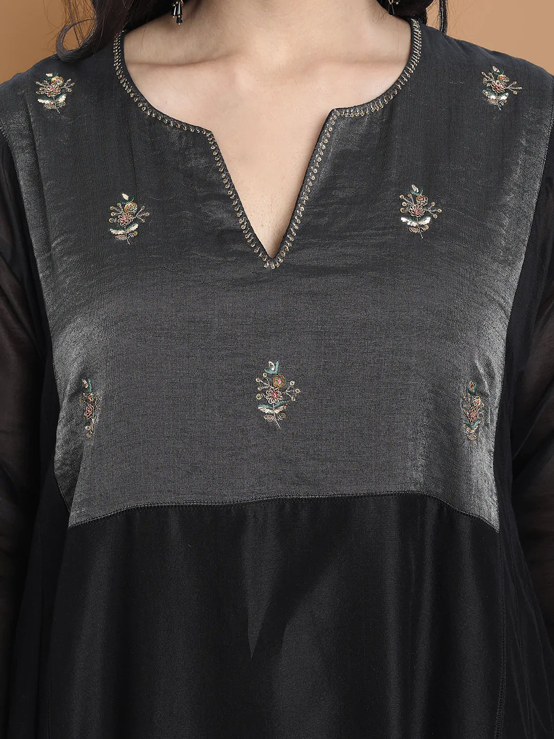 Black silk chanderi Dress Accentuated with Exquisite hand embroidery signifing beauty is in the detailing.