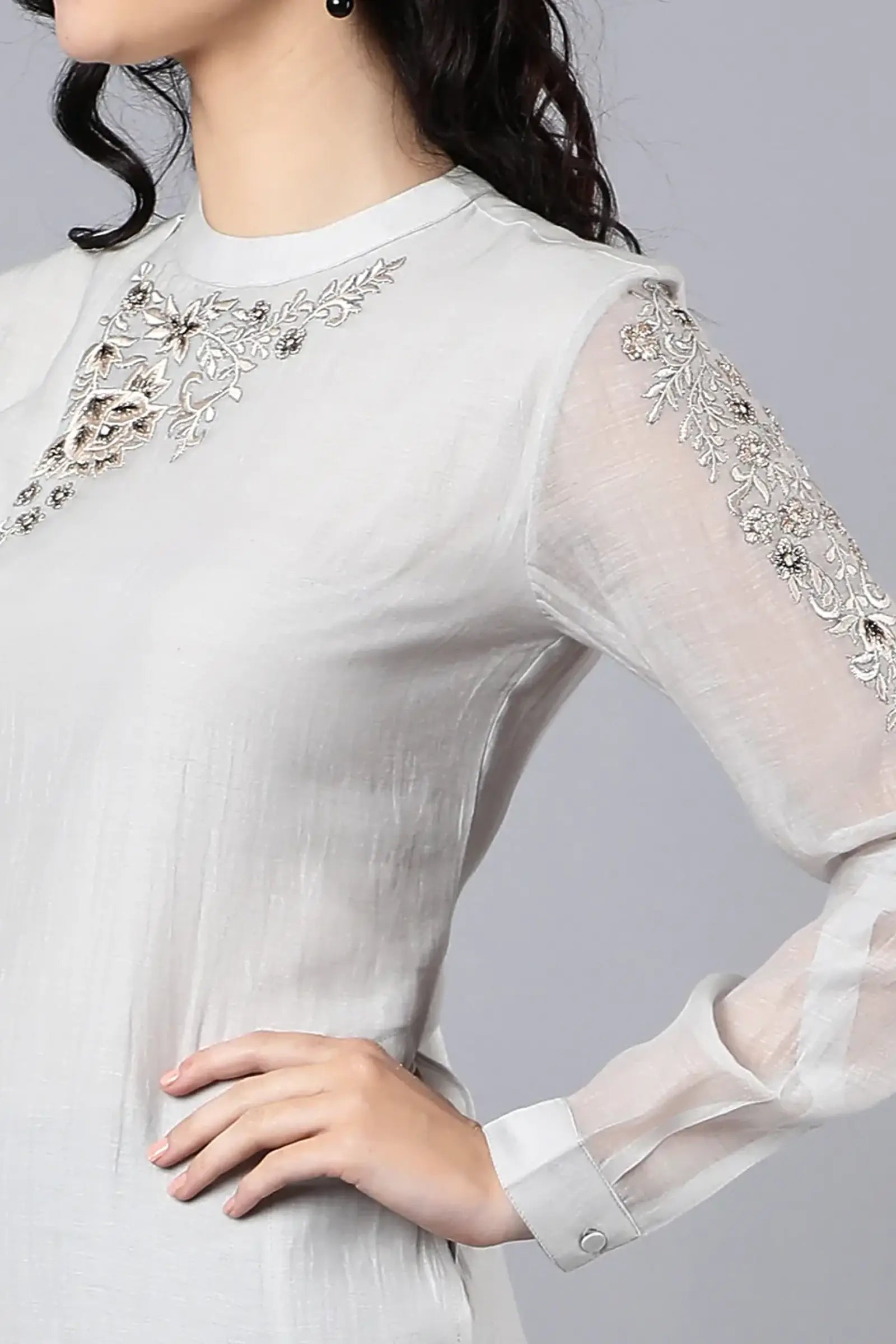 Chanderi kurta with resham and badla embroidery paired with chanderi pencil pants