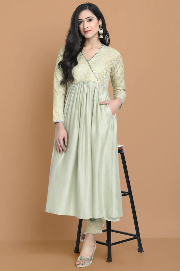 Hand embroidered dress made in combination with silk jacquard and silk chanderi , paired with bemberg cotton trouser